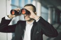Businessman using binoculars in office Royalty Free Stock Photo