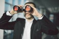 businessman using binoculars in office Royalty Free Stock Photo