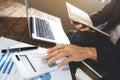 Businessman using calculator analyzing on company profits at a modern office Royalty Free Stock Photo