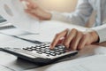 businessman using calculator for calculate budget on table in of Royalty Free Stock Photo