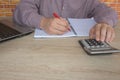 Businessman using a calculator to calculate the numbers. Accounting , Accountancy, Calculation Concept