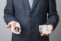 Businessman using car key and money Royalty Free Stock Photo