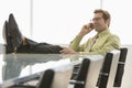 Businessman Using Cell Phone In Conference Room Royalty Free Stock Photo