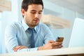 Businessman Using Cell Phone in a office Royalty Free Stock Photo