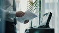Businessman Using Copy Machine in Office Environment Royalty Free Stock Photo
