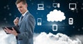 Businessman using digital tablet against cloud computing concept in sky Royalty Free Stock Photo