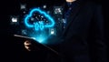 Businessman Using Digital Tablet with Cloud Storage Interface and Security Icons in Dark Background for Technology and Royalty Free Stock Photo