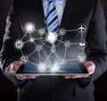 Businessman using digital tablet with various virtual icons Royalty Free Stock Photo