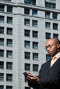 Businessman using handheld computer Royalty Free Stock Photo