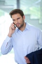 Businessman using his phone in the office - Successful businessman - blue shirt Royalty Free Stock Photo