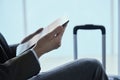 Businessman using his tablet at the airport Royalty Free Stock Photo