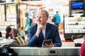 Businessman using his tablet at the airport Royalty Free Stock Photo