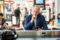 Businessman using his tablet at the airport Royalty Free Stock Photo