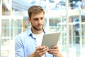 Businessman using his tablet in the office Royalty Free Stock Photo