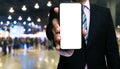 Businessman using holding smartphones white screen showing information on bokeh background