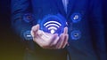 Businessman using holding with wifi icon. Social network business communication concept, Wifi wireless concept free network Royalty Free Stock Photo