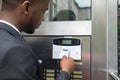 Businessman Using Keycard To Open Door