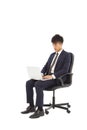 Businessman using laptop on the chair Royalty Free Stock Photo