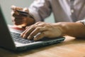 Businessman using laptop computer with a credit card making an online order. Royalty Free Stock Photo