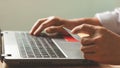 Businessman using laptop computer with a credit card making an online order. Royalty Free Stock Photo