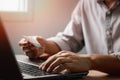 Businessman using laptop computer with a credit card making an online order. Royalty Free Stock Photo