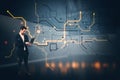 Businessman using laptop with glowing circuit board lines on dark background Royalty Free Stock Photo