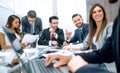 Businessman using laptop during a meeting of the Board of Directors