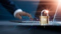 Businessman using laptop and set up network connection with shield guard to protect cyber attacks. Padlock of personal data