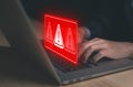 Businessman using laptop showing warning triangle and exclamation sign icon Warning of dangerous problems Server error. Virus. Royalty Free Stock Photo