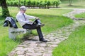 Businessman using laptop sitting on a bench Royalty Free Stock Photo