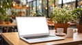 Mockup image of laptop with blank white screen on wooden table in cafe. AI Generated Royalty Free Stock Photo