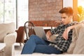 Businessman using laptop on sofa in coffee shop Royalty Free Stock Photo