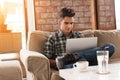 Businessman using laptop on sofa in coffee shop Royalty Free Stock Photo