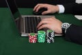 Businessman Using Laptop By Stacked Poker Chips Royalty Free Stock Photo