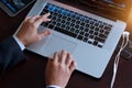 Businessman using laptop working with stock market exchange Royalty Free Stock Photo