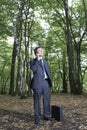 Businessman Using Mobile Phone In Forest Royalty Free Stock Photo