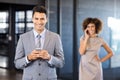 Businessman using mobile phone in office Royalty Free Stock Photo