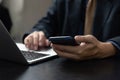 Businessman using mobile smart phone and computer laptop in modern office.Business Technology internet digital concept Royalty Free Stock Photo