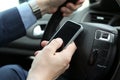 businessman using mobile smart phone while driving the car Royalty Free Stock Photo