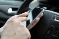 Businessman using mobile smart phone while driving the car Royalty Free Stock Photo