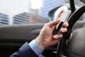 The businessman using mobile smart phone while driving the car Royalty Free Stock Photo