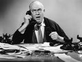 Businessman using multiple phones