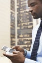 Businessman Using PDA Outside Building Royalty Free Stock Photo