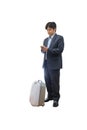 Businessman using phone with luggage