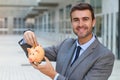 Businessman using a piggybank to save money Royalty Free Stock Photo
