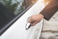 Businessman using remote control to open car door Royalty Free Stock Photo