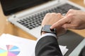 Businessman using a smart watch at office Royalty Free Stock Photo