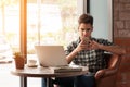 Businessman using smartphone and laptop