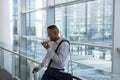 Businessman using smartphone in modern building Royalty Free Stock Photo