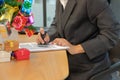 businessman using stamper for stamping approved on contract agreement document during christmas Royalty Free Stock Photo